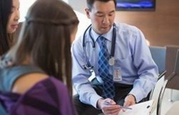 image of doctor talking to patient