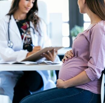 Doctor with pregnant woman 