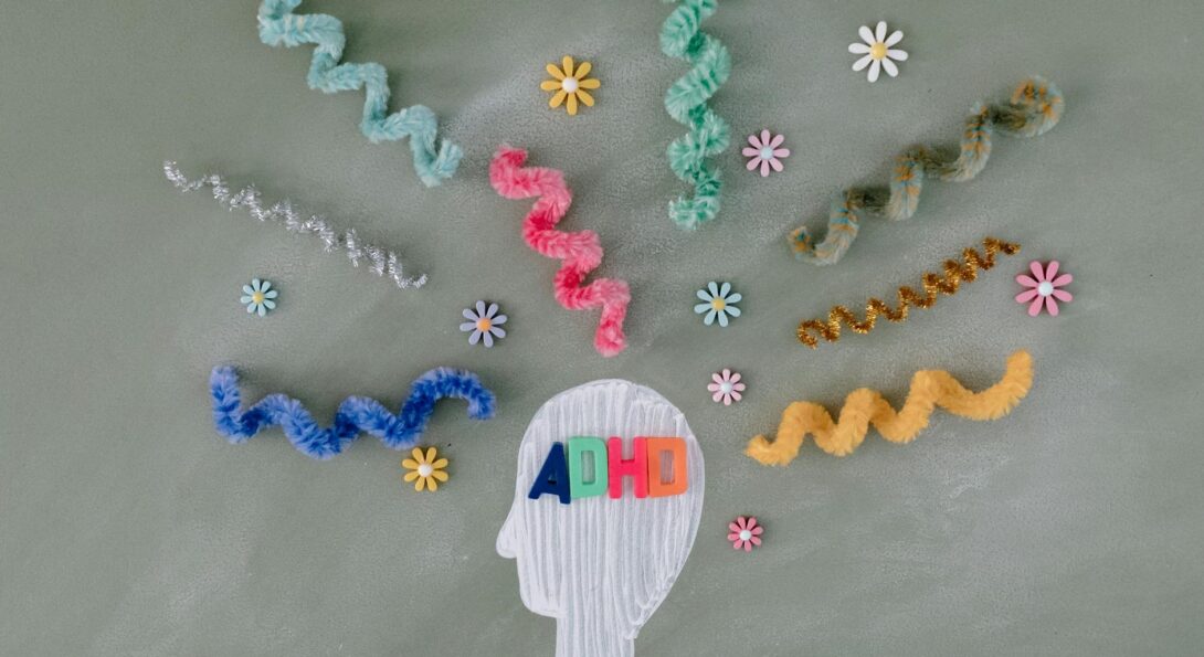 adhd written in outline of head with pipe cleaners coming out